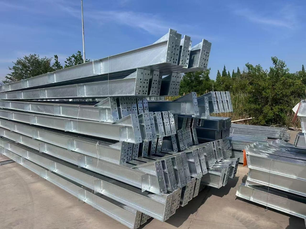Stack of galvanized structural steel columns and beams